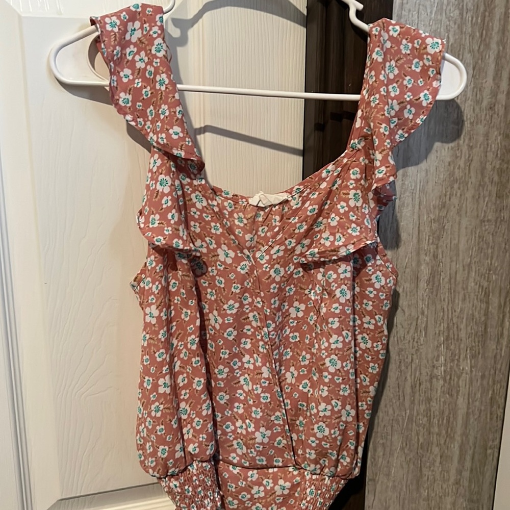 Really super cute top great for summer wear it with shorts or jeans